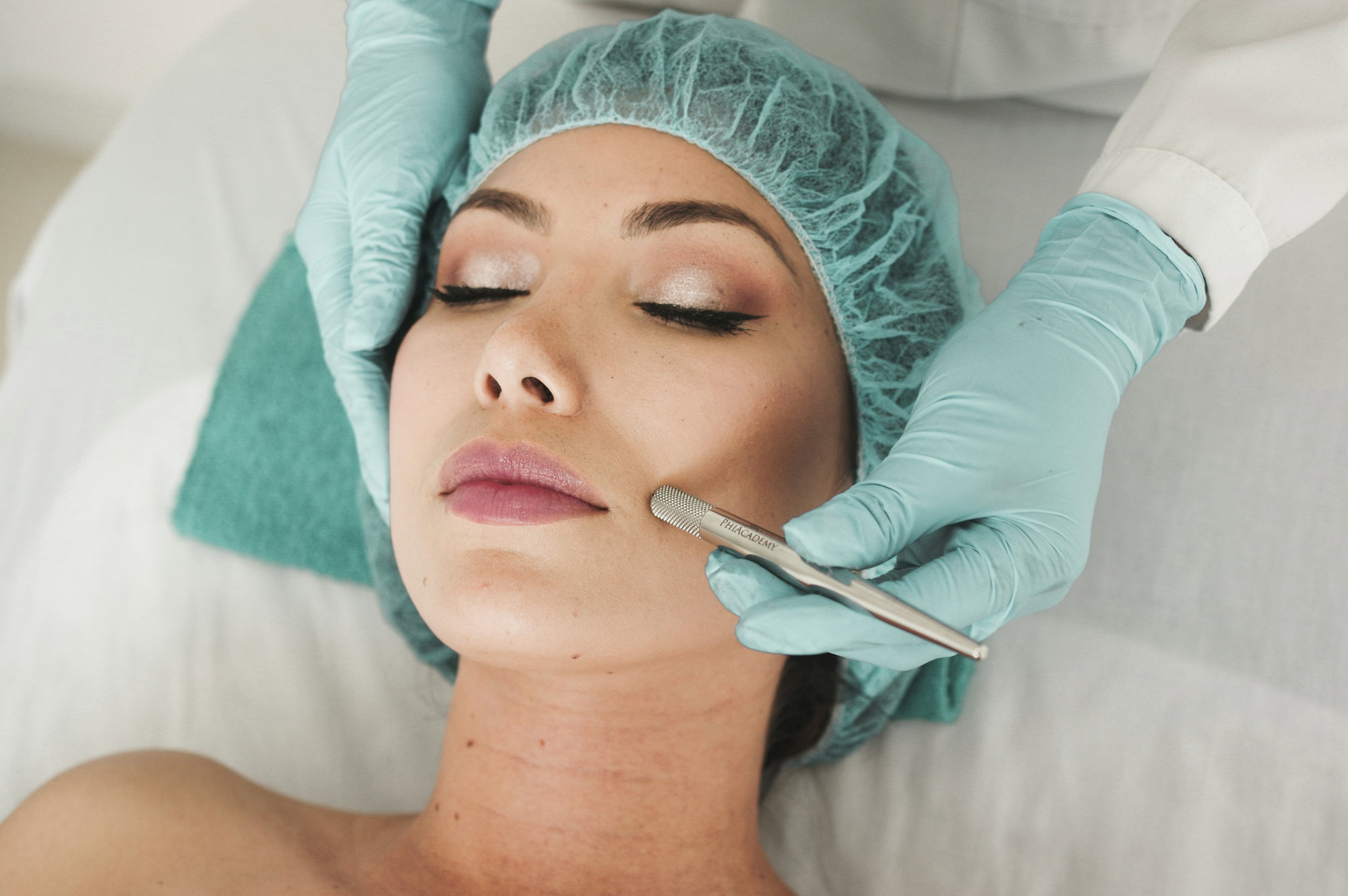 woman-receiving-facial-skincare-treatment.jpg woman receiving facial skincare treatment